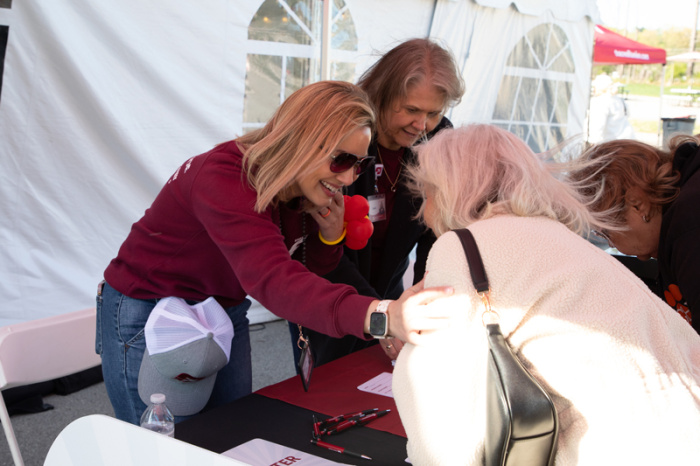 Credit union employee and member laughing and talking