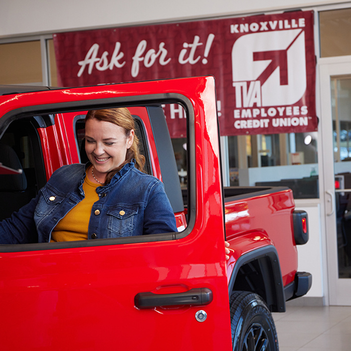 Girl getting into a Jeep at a KTVAECU Preferred Car Dealership.