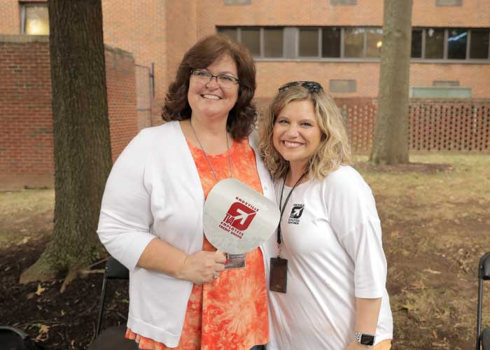 Employee Helping at community event