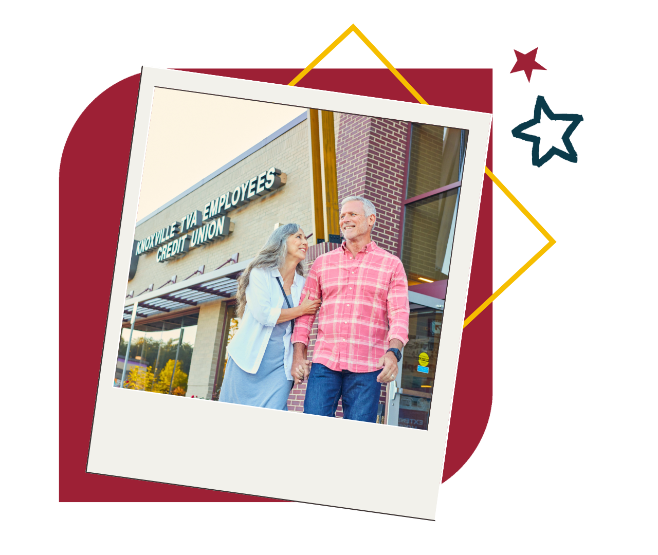 Couple smiling in front of a KTVAECU branch