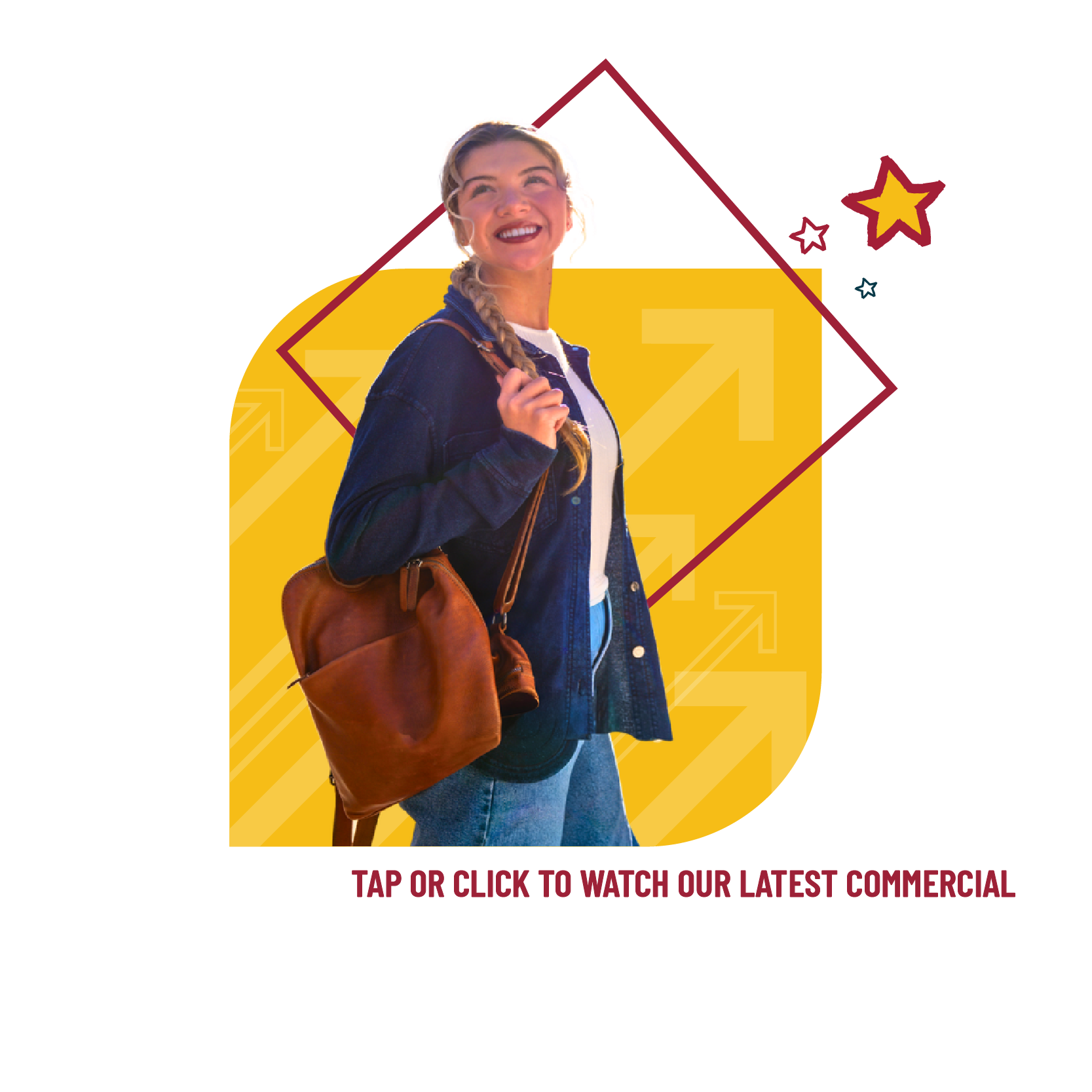 Lady in navy top holding a backpack and smiling.