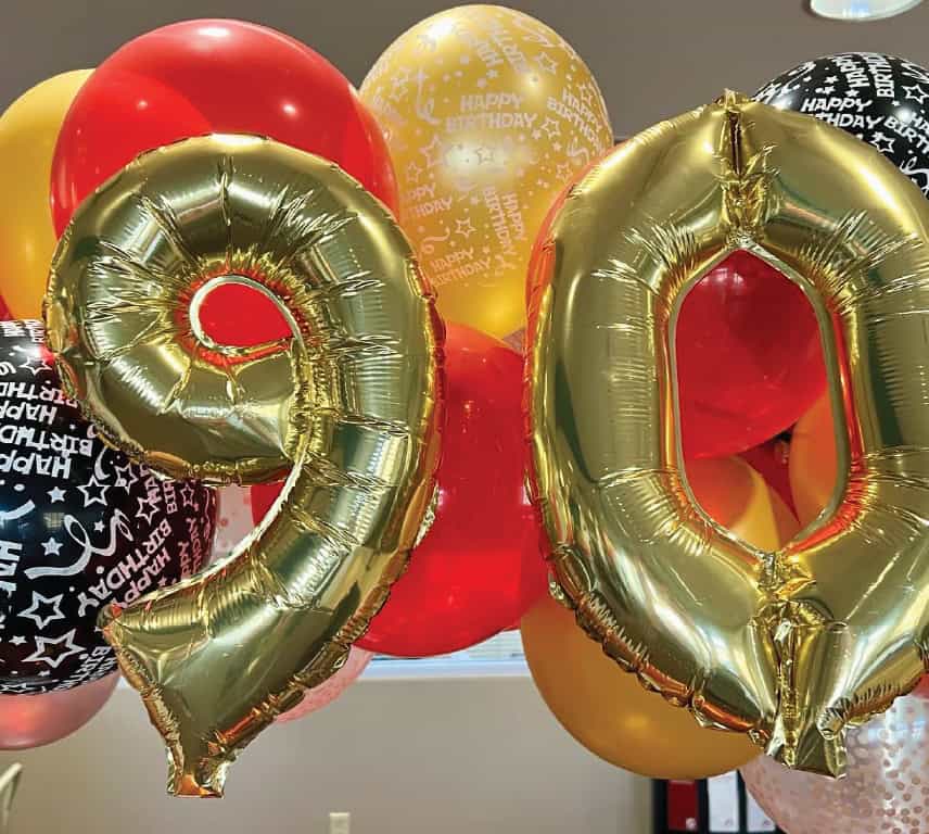 Foil balloons in the shape of a 9 and a 0