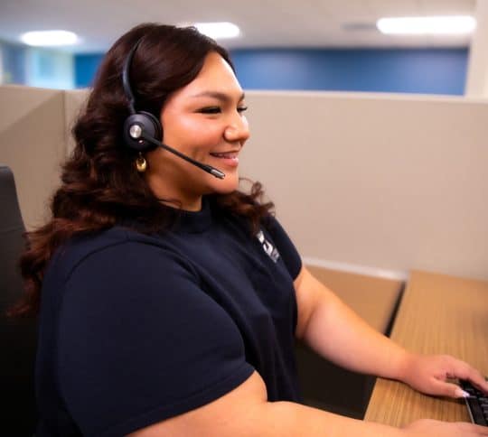 KTVAECU Contact Center Employee speaking on a headset