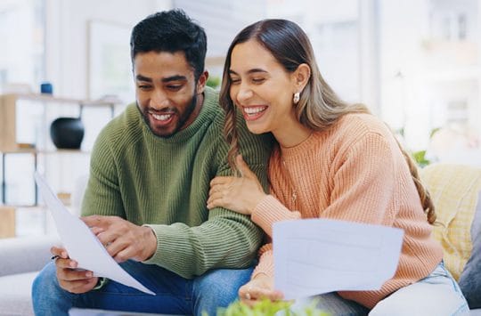 Couple looking at credit scores.