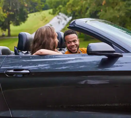 Friends in vehicle driving off