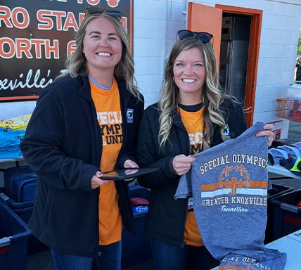 Two KTVAECU Employees at a Special Olympics event