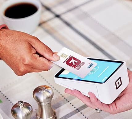 KTVAECU Debit Card being tapped to a point of sale system