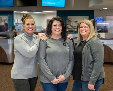 Real Estate Loan Officers smiling for a photo in a branch
