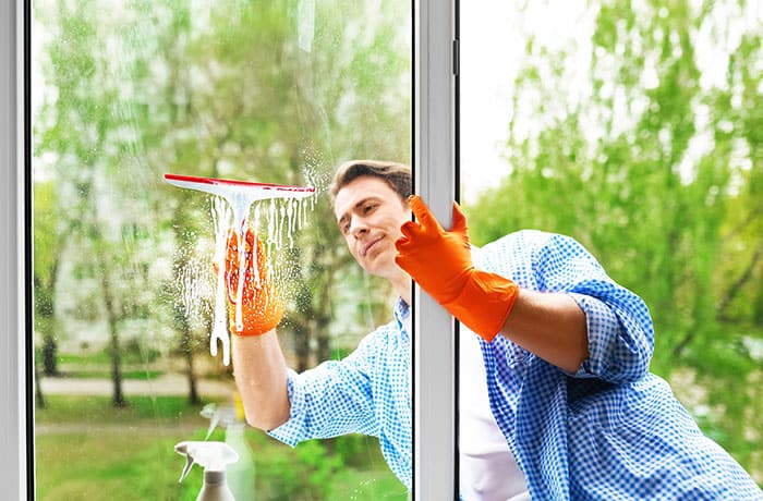 Man cleaning the windows.