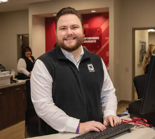 KTVAECU Staff member working at the Holston Branch desk
